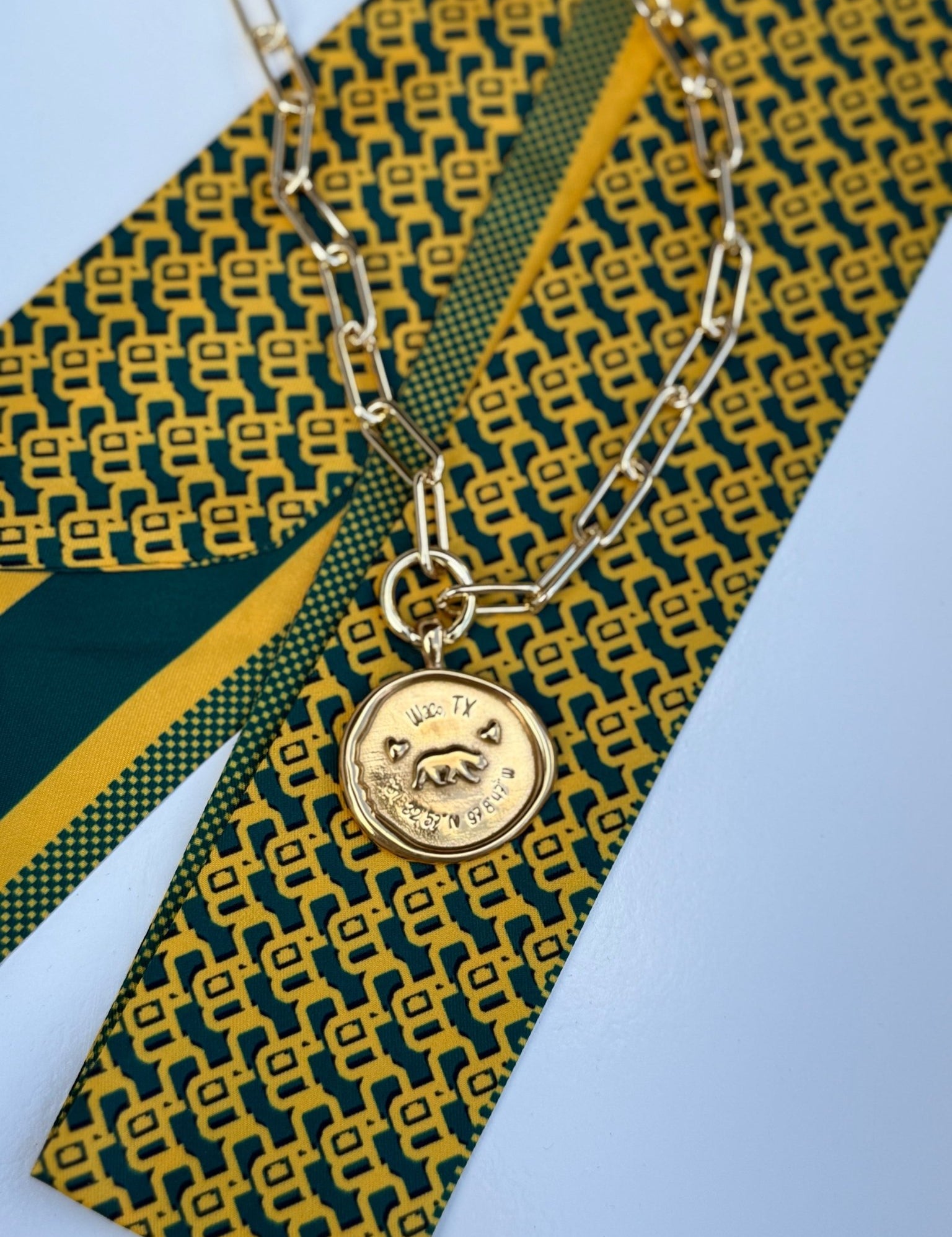 Waco Necklace with a gold medallion engraved Waco, Texas and its coordinates, alternate view