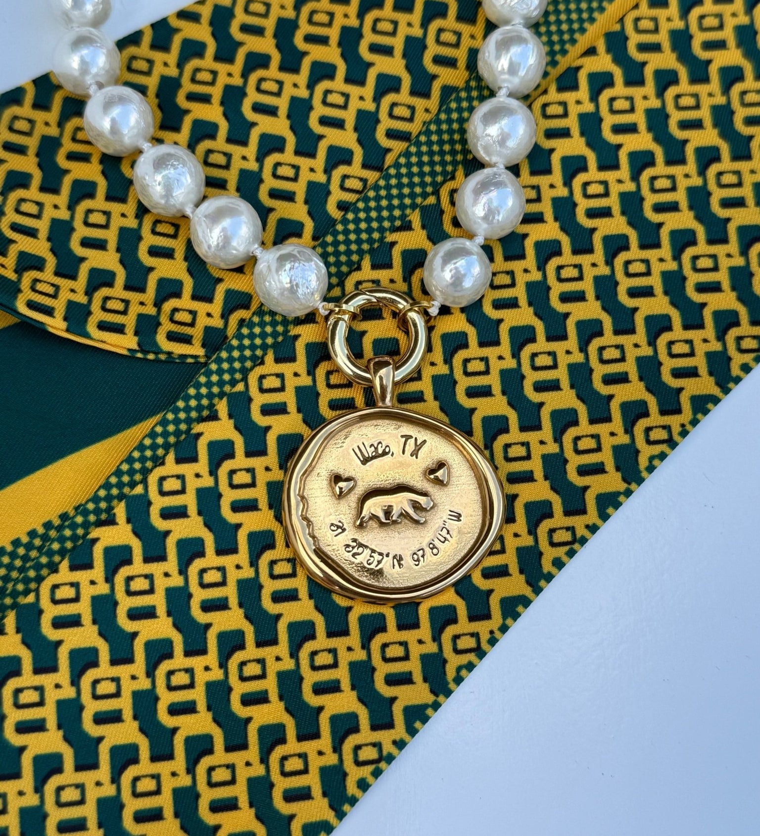 Waco Necklace with a gold medallion engraved Waco, Texas and its coordinates