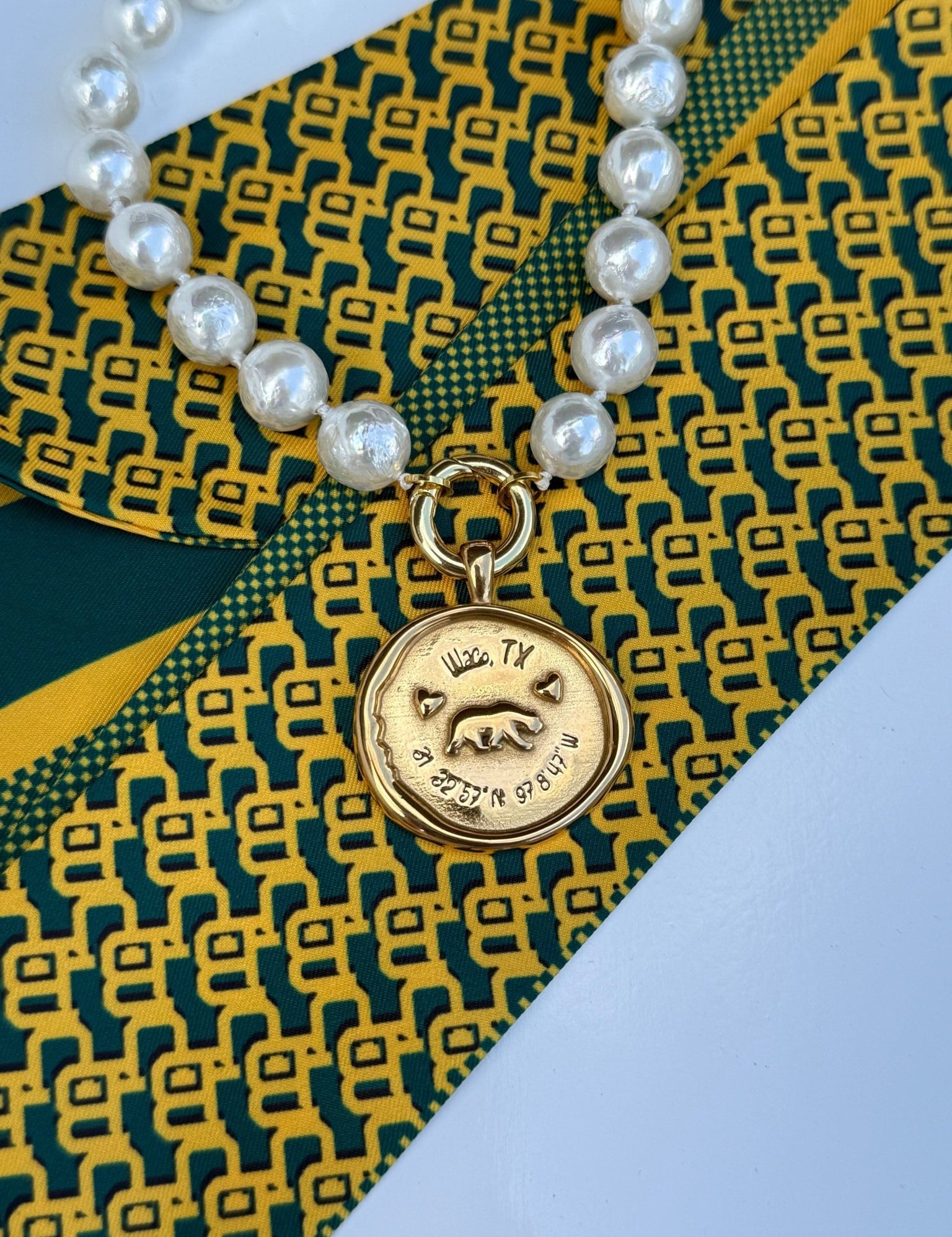 Waco Necklace with a gold medallion engraved Waco, Texas and its coordinates