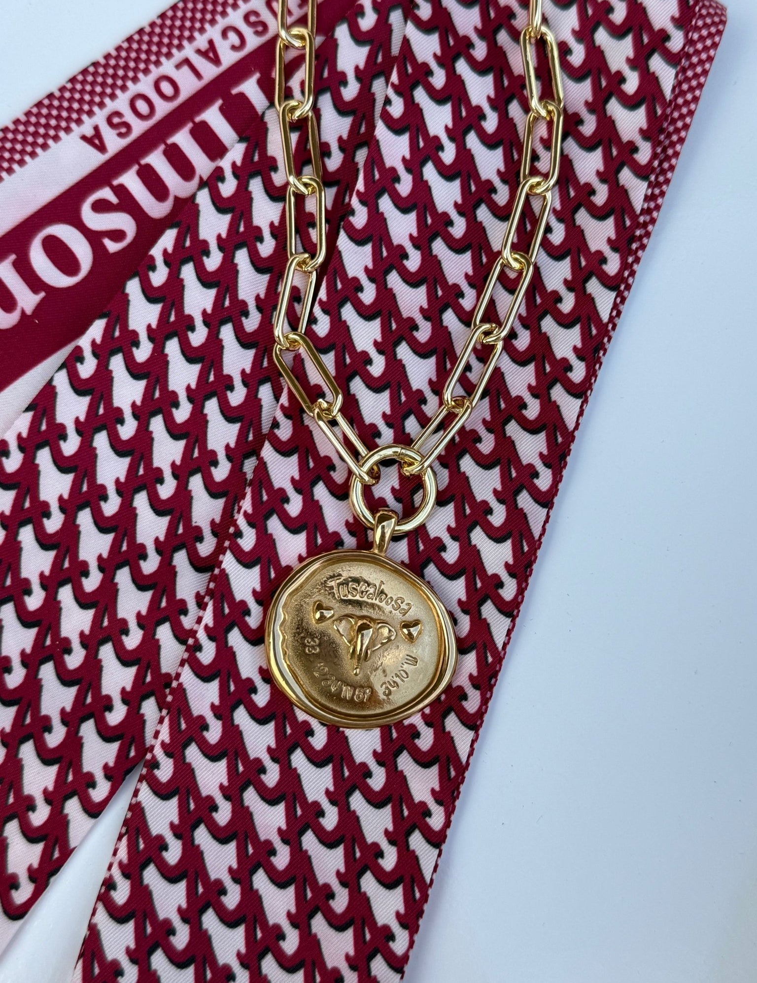 Tuscaloosa Necklace with a gold medallion engraved Tuscaloosa, Alabama and its coordinates, alternate view