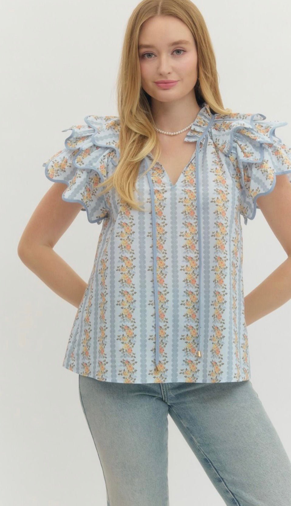 Floral Trellis Top, an airy floral trellis flared top, worn front view