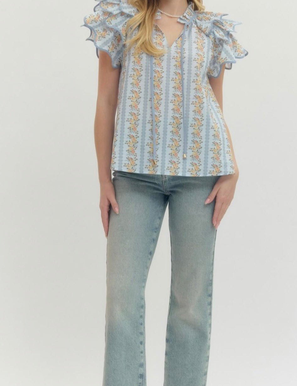 Back view of the Floral Trellis Top, an airy floral trellis flared top