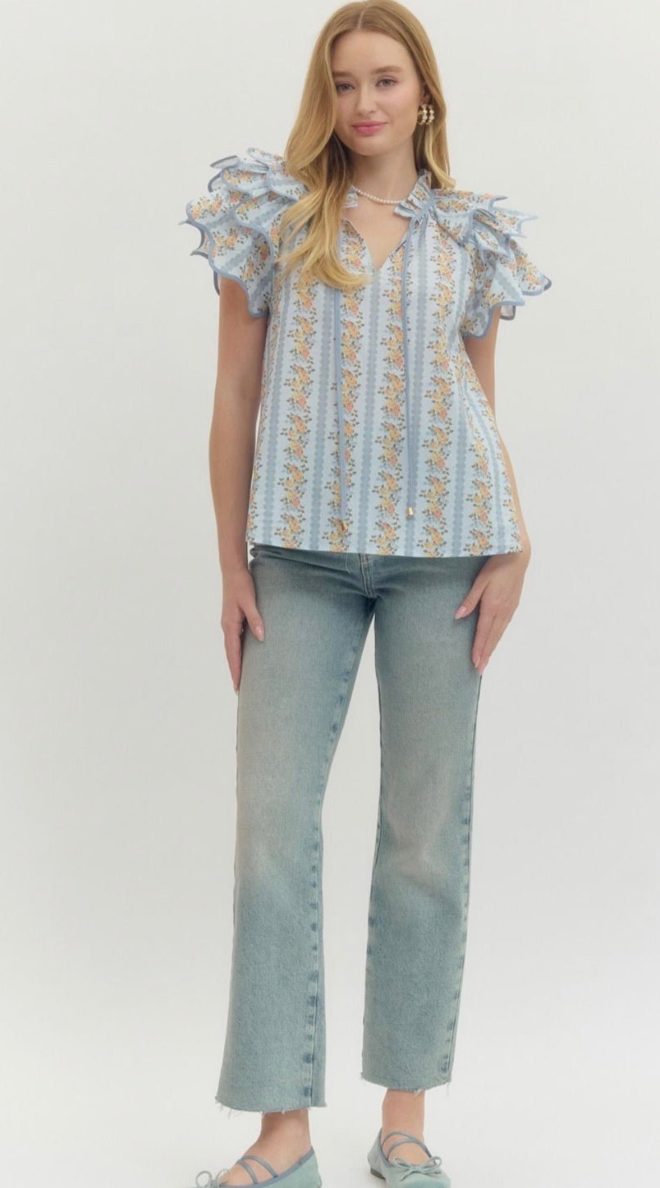 Back view of the Floral Trellis Top, an airy floral trellis flared top