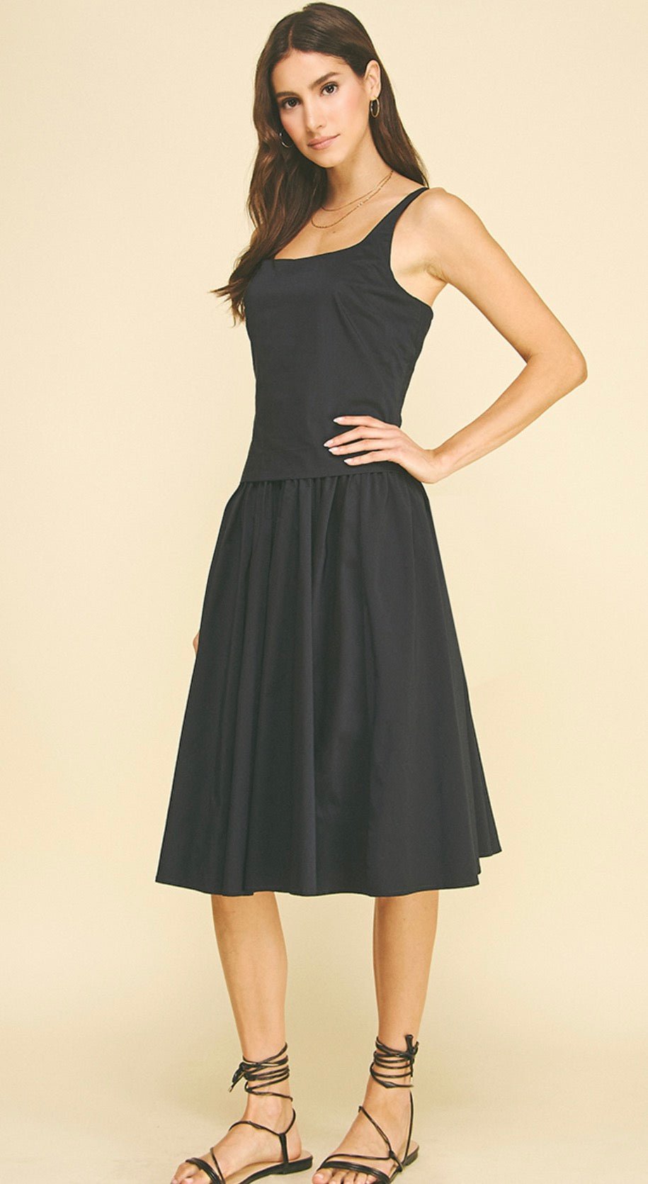 Back view of the Blue/Black Midi Dress, a black square-neck midi dress
