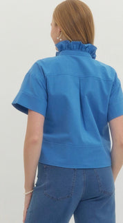 Back view of the Blue Ruffle Neck Top, a blue cropped ruffle neck button-down – Lady & Tucker