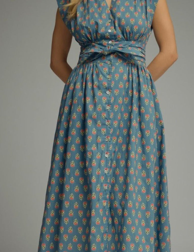 Patterned Poppy Dress, a blue floral midi with flutter sleeves, worn front view