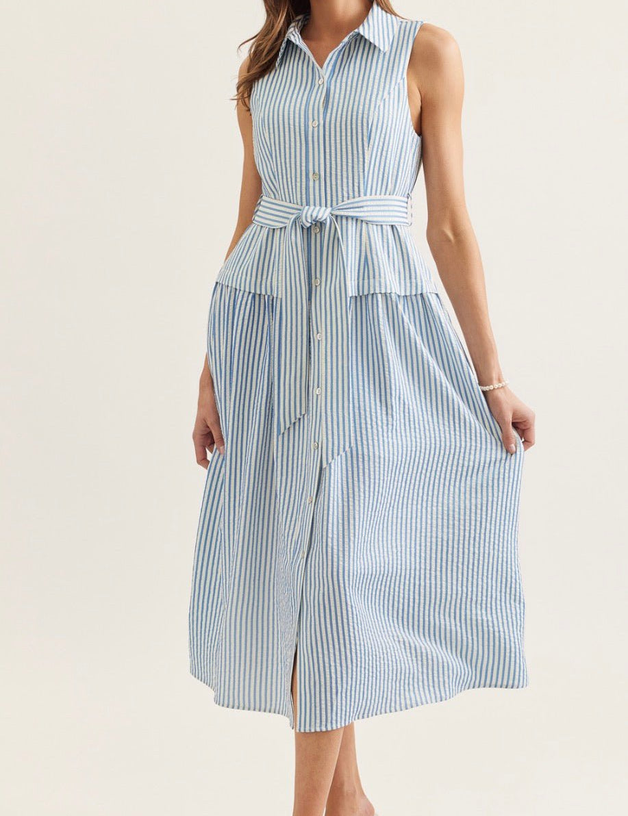 Savannah Stripe Dress, a blue and white stripe sleeveless midi shirt dress, worn front view