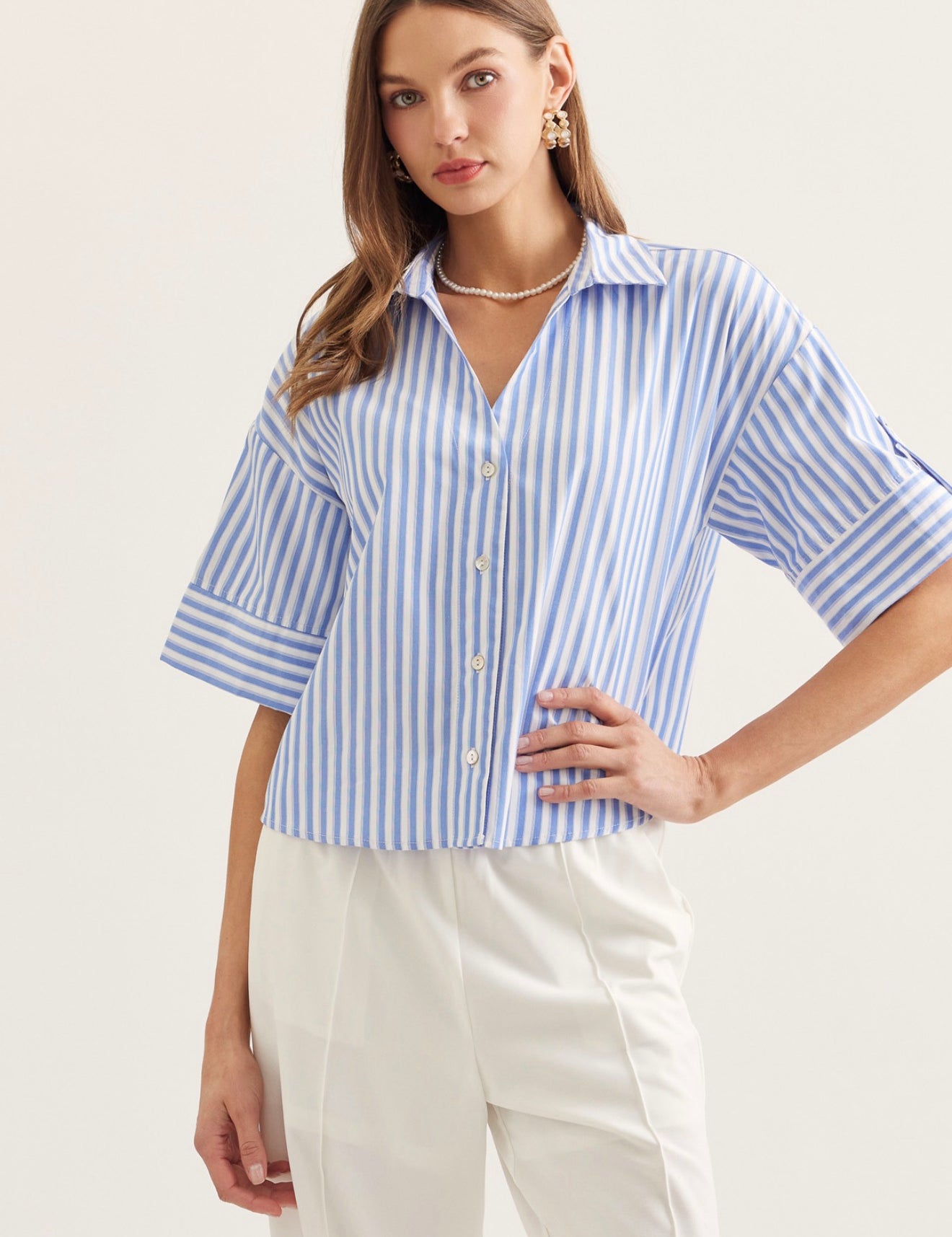 Seaside Stripe Top, a blue and white stripe menswear-inspired top, worn front view