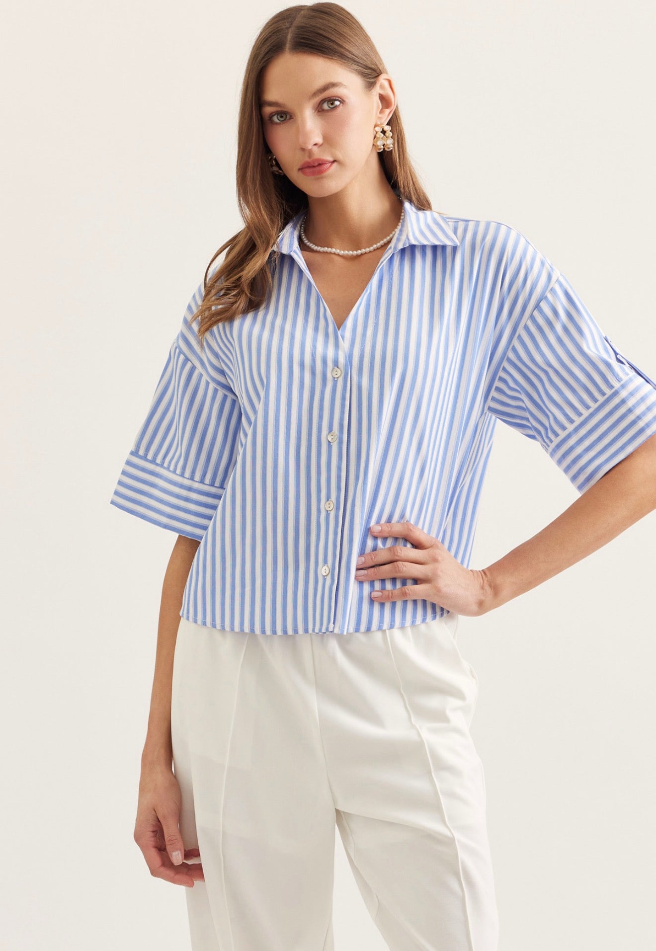 Seaside Stripe Top, a blue and white stripe menswear-inspired top, worn front view