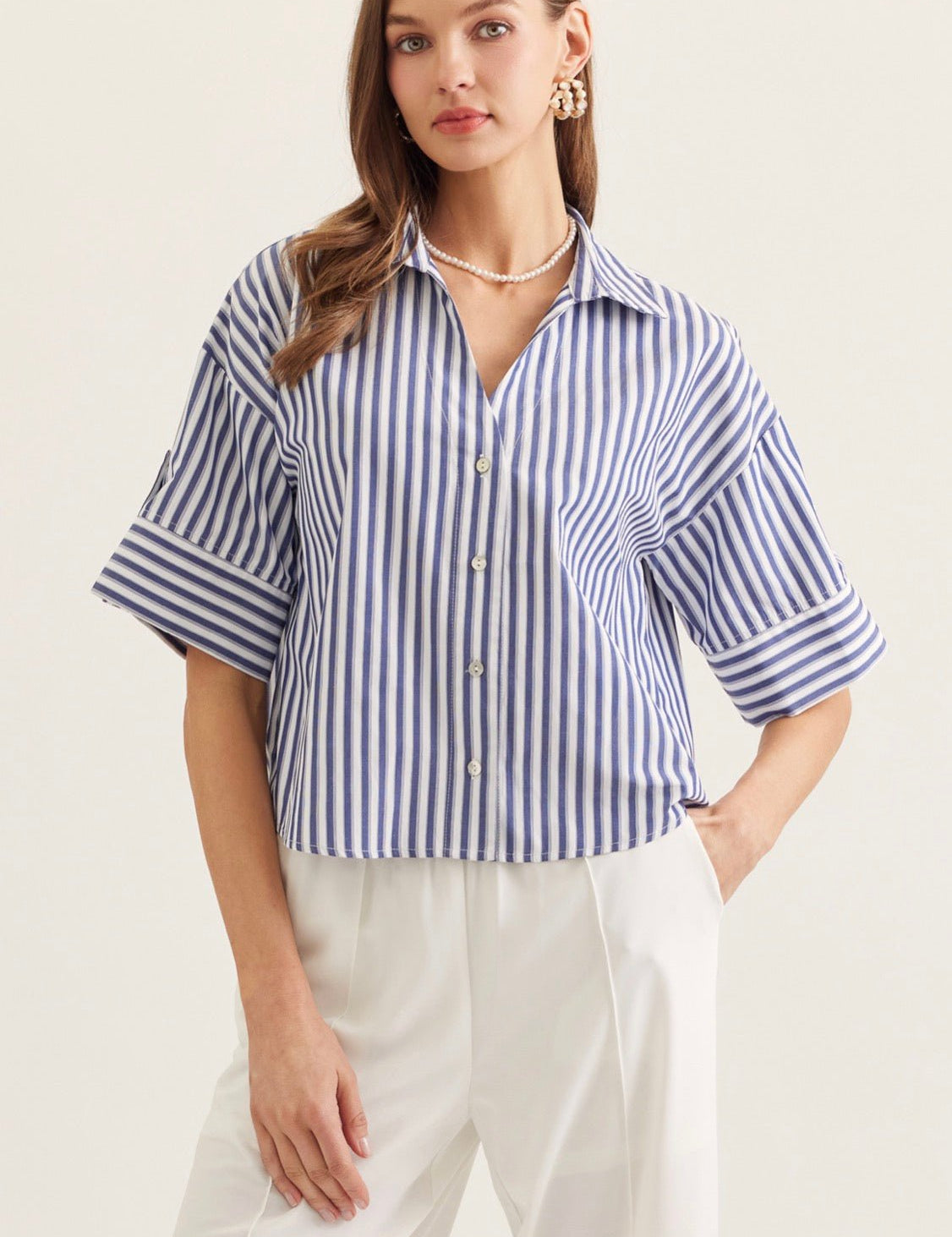 Back view of the Seaside Stripe Top, a blue and white stripe menswear-inspired top
