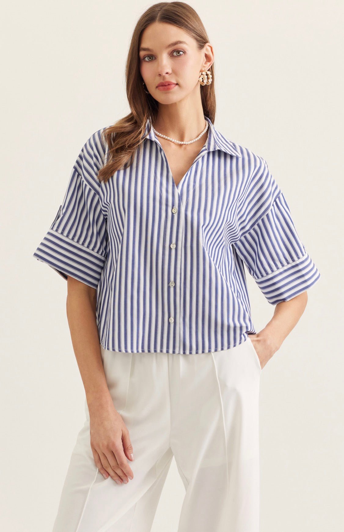 Back view of the Seaside Stripe Top, a blue and white stripe menswear-inspired top