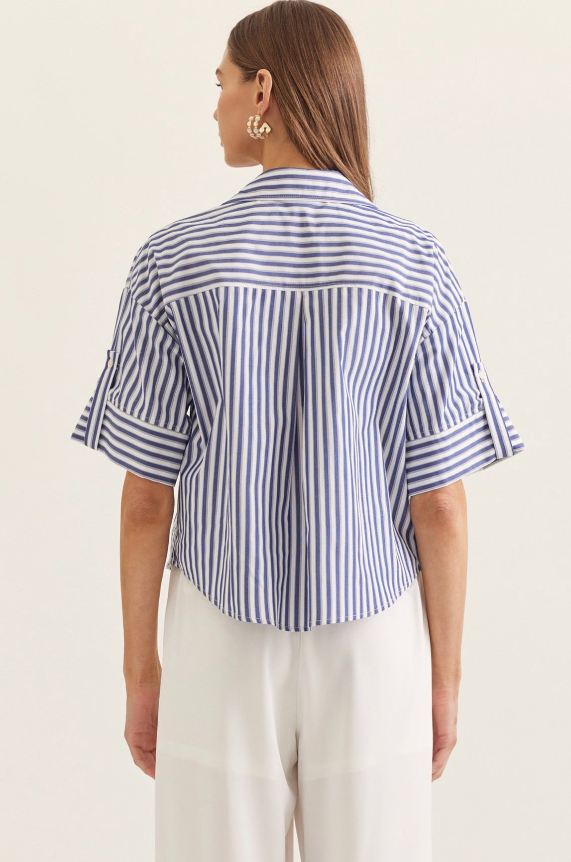 Seaside Stripe Top styled on model, a blue and white stripe menswear-inspired top – Lady & Tucker