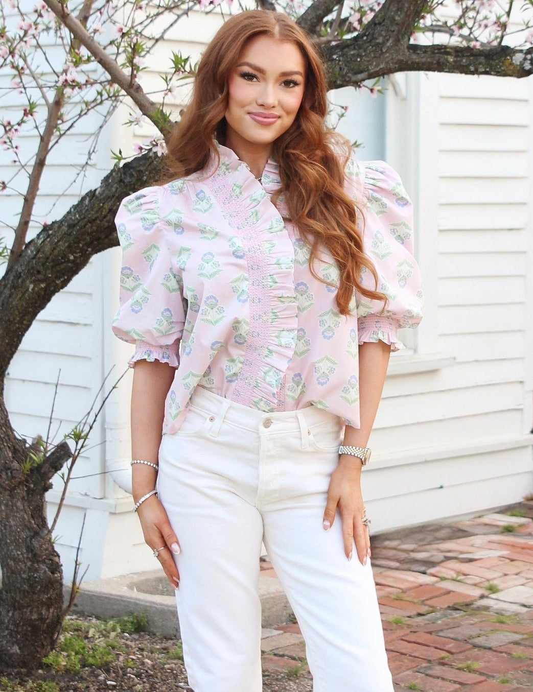 French Floral Pink Top, a blush pink blouse with blue and sage florals, worn front view