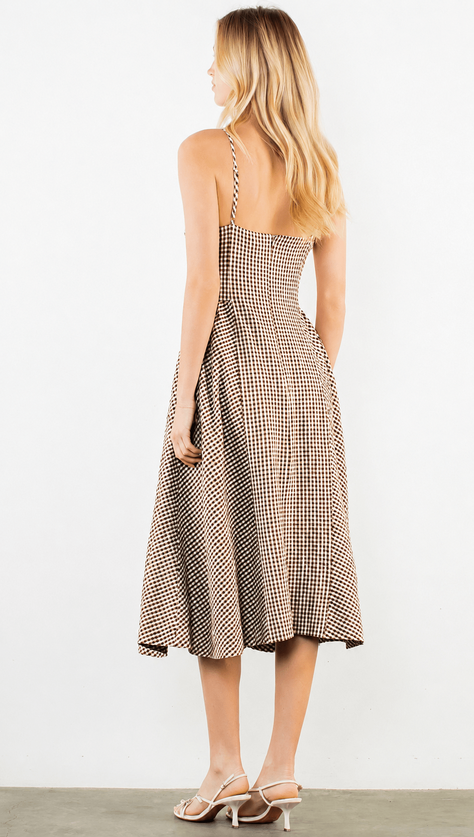 Back view of the Goody Gingham Dress, a brown and white gingham midi
