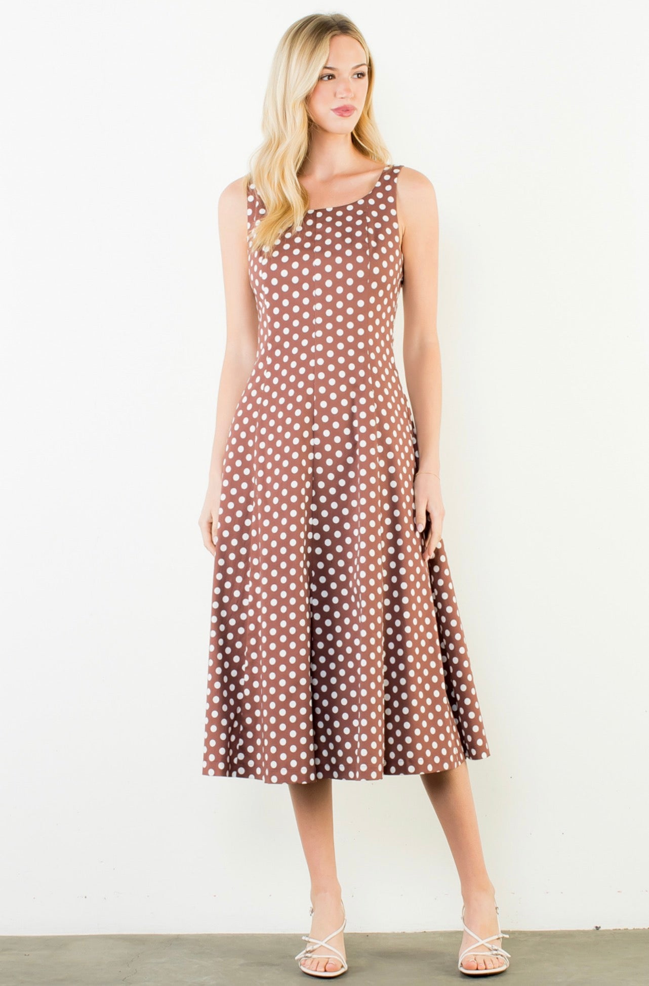 Close-up of the white polka dots and square neckline on the Polka Dot Brown Dress
