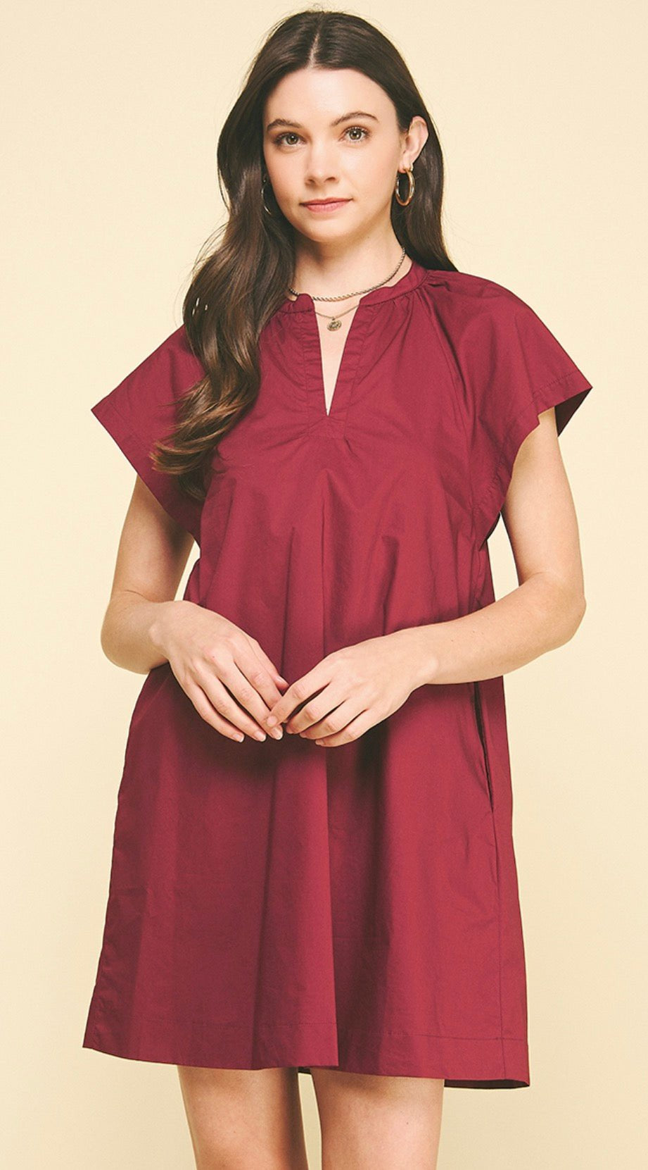 Back view of the Maroon Mini Dress, a burgundy mini shift dress in woven cotton