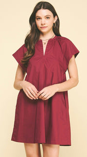 Back view of the Maroon Mini Dress, a burgundy mini shift dress in woven cotton