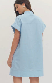 Close-up of the hidden button placket and side pockets on the Chambray Mini Dress – Lady & Tucker