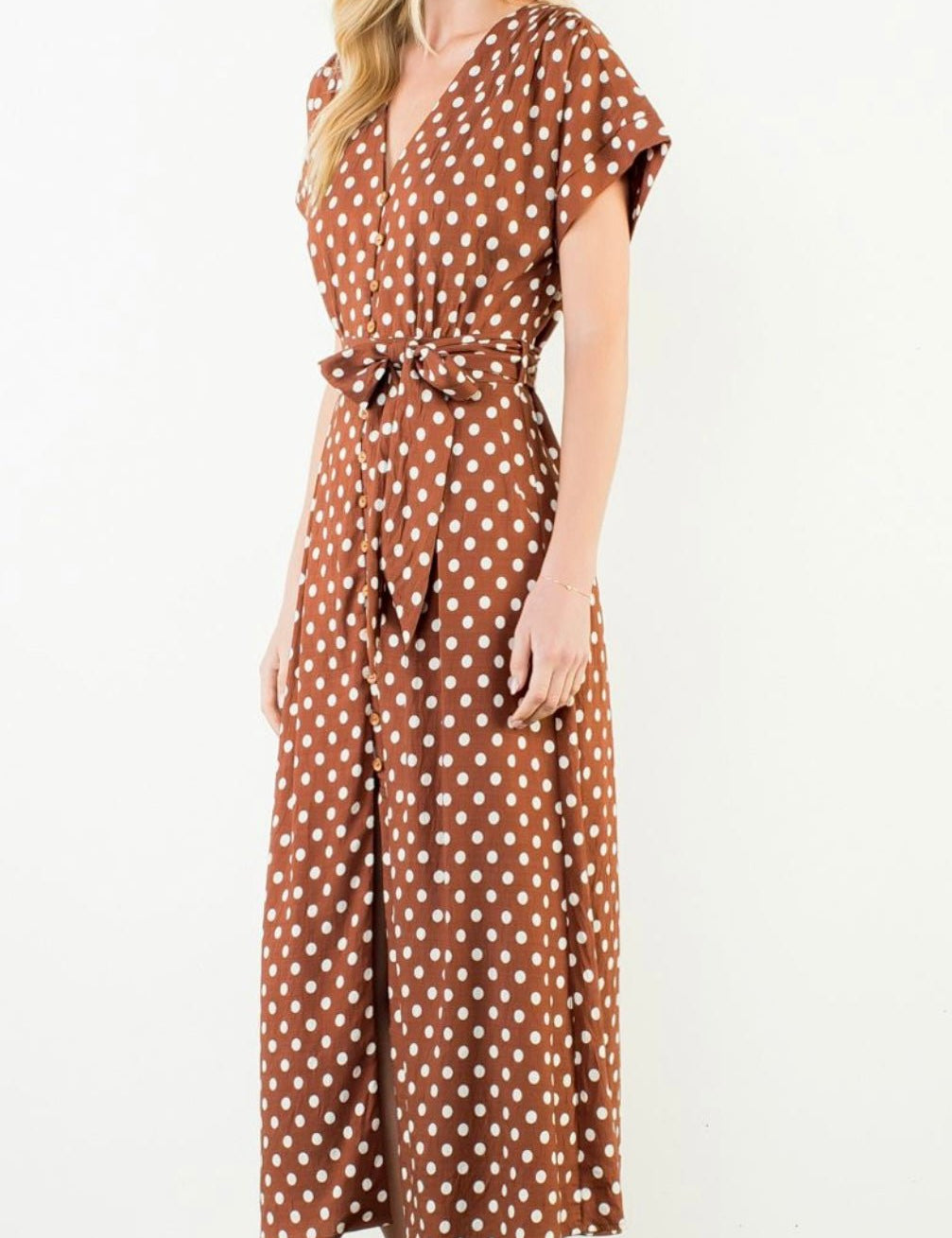 Back view of the Short Sleeve Polka Dot Dress, a cinnamon brown polka dot short sleeve midi