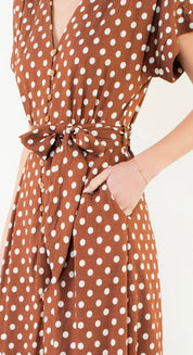 Short Sleeve Polka Dot Dress styled full length, a cinnamon brown polka dot short sleeve midi