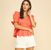 Sun Orange Top styled on model, a coral pintuck blouse – Lady & Tucker
