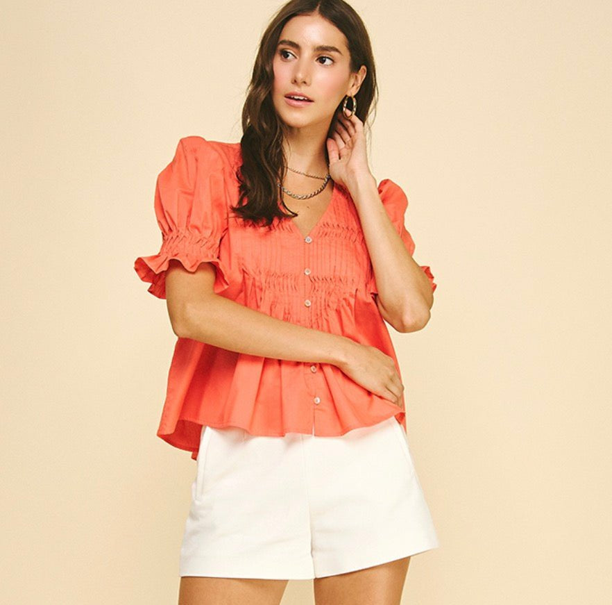 Sun Orange Top styled on model, a coral pintuck blouse – Lady & Tucker