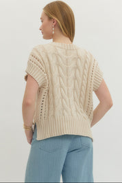 Back view of the Cream Sweater Vest Top, a cream cable-knit sweater vest – Lady & Tucker