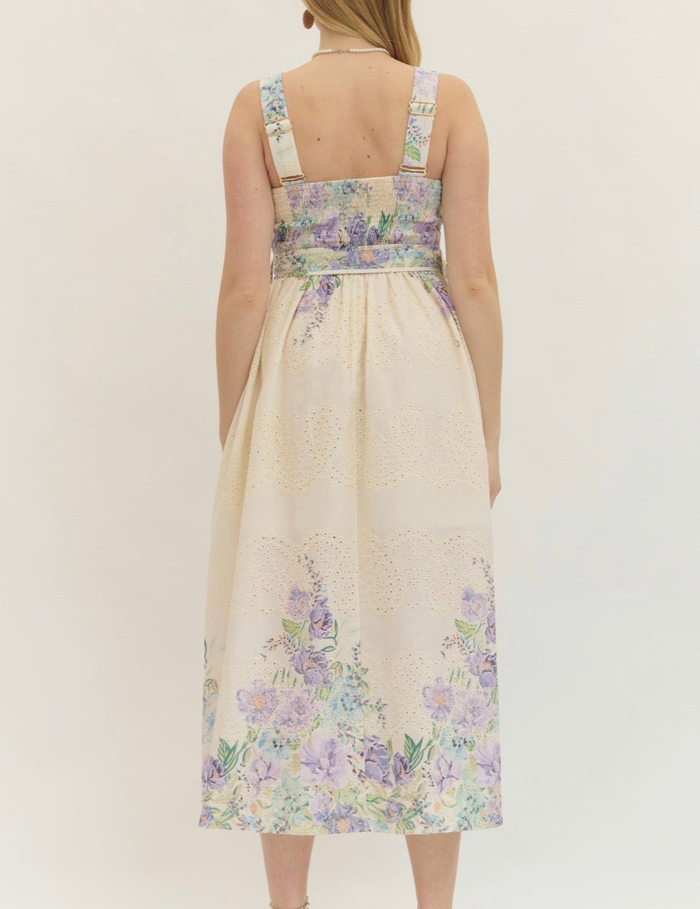 Back view of the Lavender Spring Dress, a cream midi with lavender floral print – Lady & Tucker