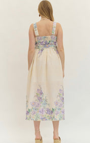 Back view of the Lavender Spring Dress, a cream midi with lavender floral print – Lady & Tucker
