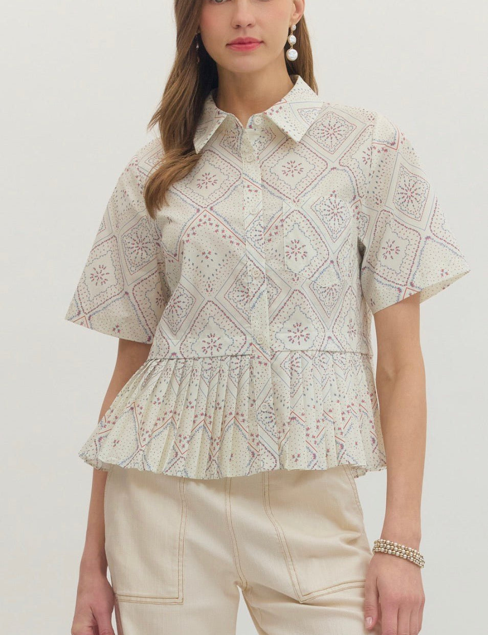 Heirloom Top, a cream geometric medallion print blouse, worn front view