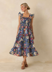 Felicity Midi Dress, a dusty blue floral smocked midi dress, worn front view