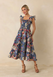 Back view of the Felicity Midi Dress, a dusty blue floral smocked midi dress