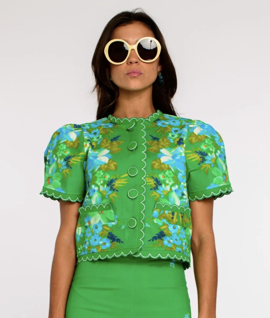 Coco Top In Hula, an Elizabeth James Hula print puff sleeve button top, worn front view
