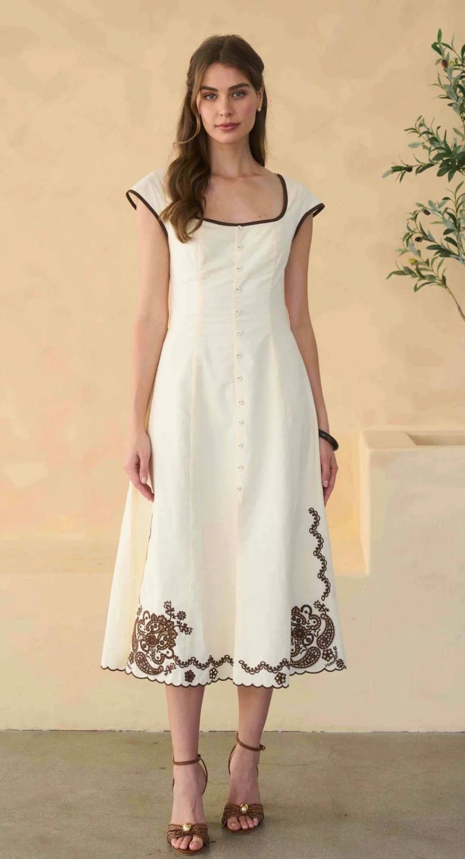 Varenna Dress, an embroidered square-neck sleeveless midi, worn front view