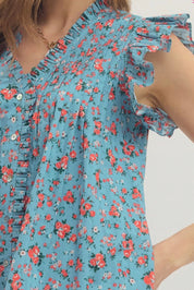 Close-up of the flowy draped silhouette on the Summer Lovin Mini Dress