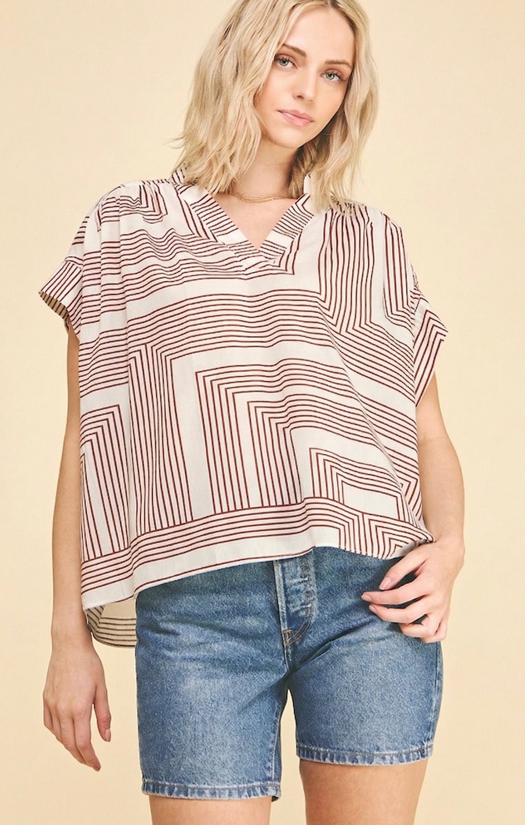 Newport Top, a flowy geometric print blouse, worn front view – Lady & Tucker