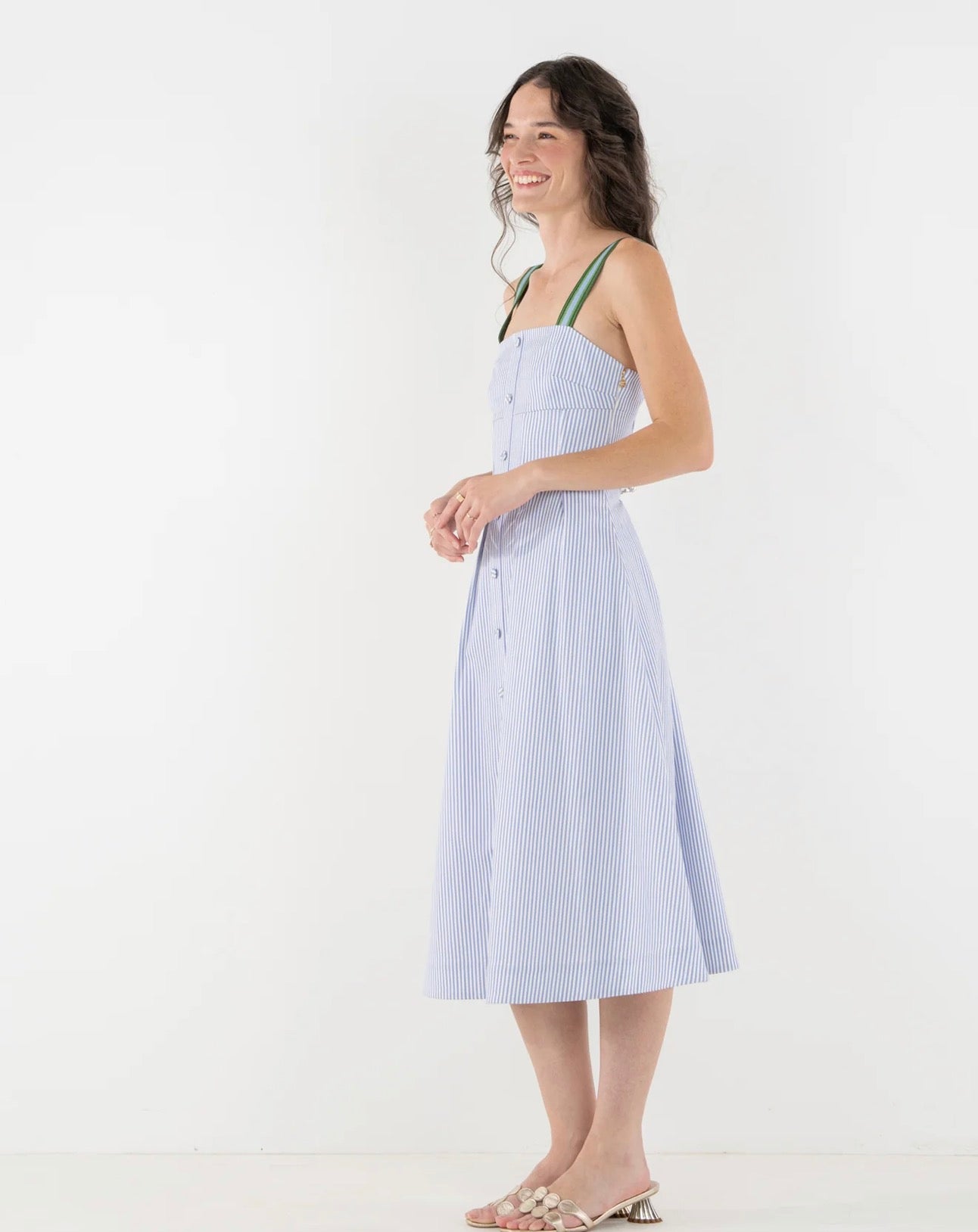 Close-up of the empire waist and fitted bodice on the Grapemist Stripe Midi Dress