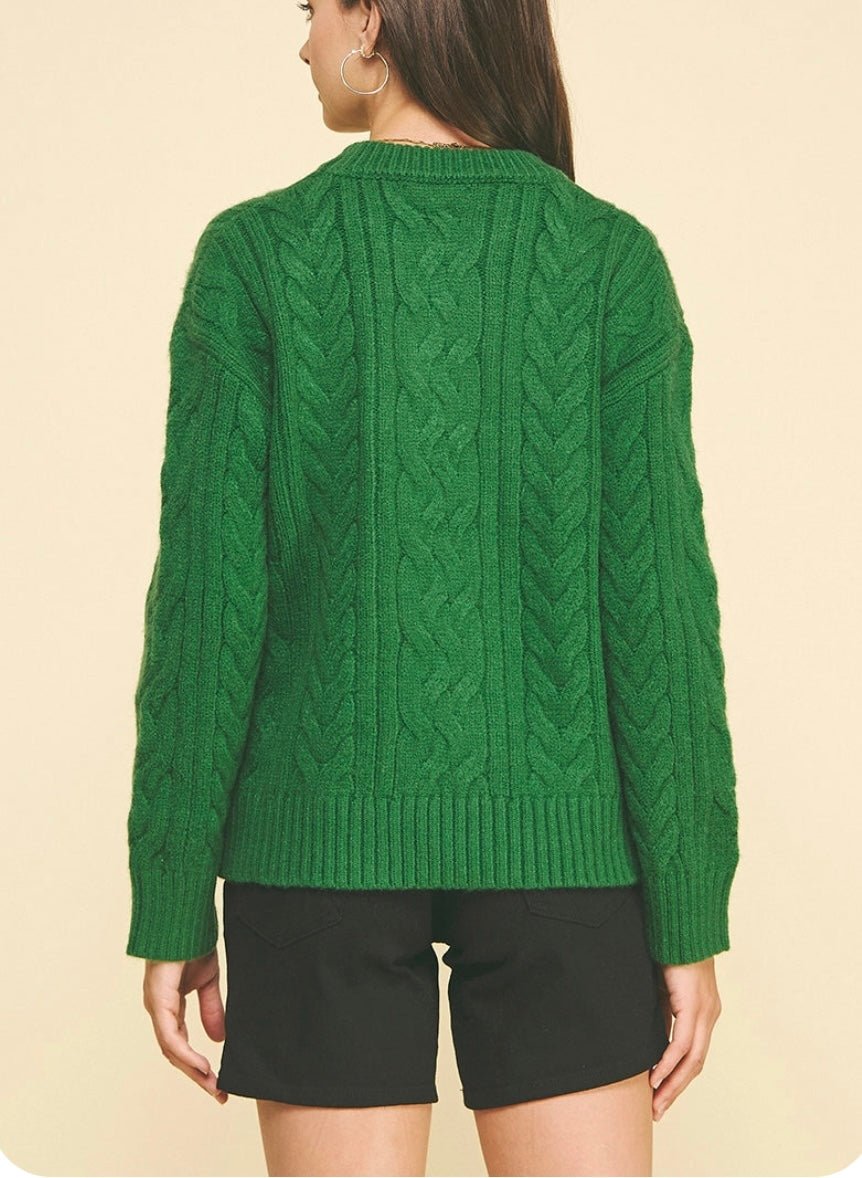 Back view of the Cable Knit Green Sweater, a green cable knit crewneck