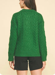 Back view of the Cable Knit Green Sweater, a green cable knit crewneck
