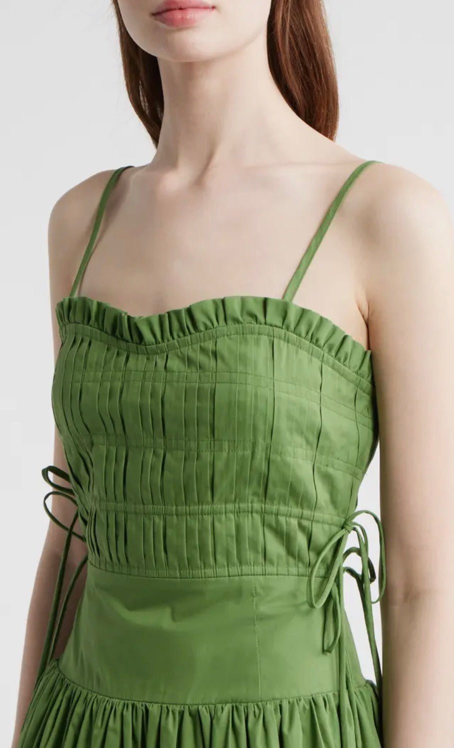 Back view of the Green Goddess Dress, a leaf green smocked midi dress