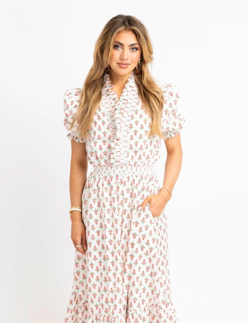 Back view of the Floral Ruffle Smocked Maxi Dress, an ivory floral smocked ruffle maxi