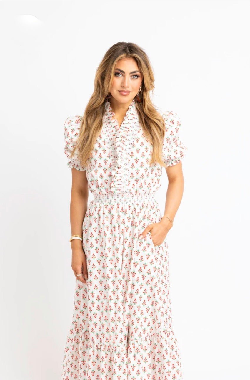Back view of the Floral Ruffle Smocked Maxi Dress, an ivory floral smocked ruffle maxi
