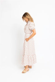 Floral Ruffle Smocked Maxi Dress styled full length, an ivory floral smocked ruffle maxi – Lady & Tucker