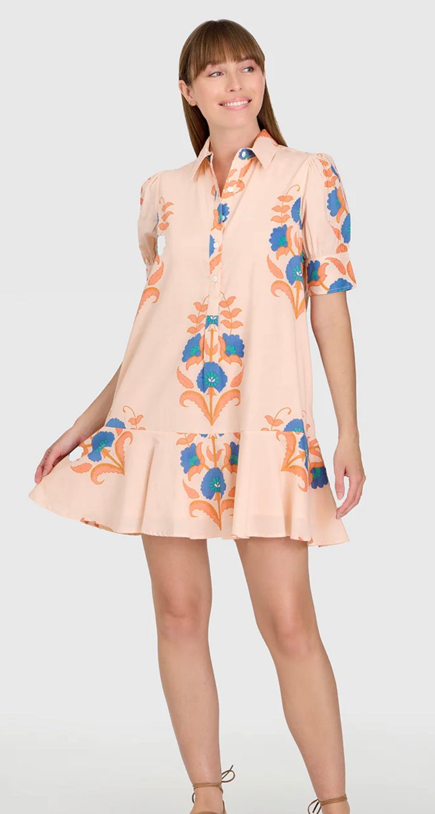 Pink Sands Liv Dress, a pink drop-waist puff sleeve mini, worn front view