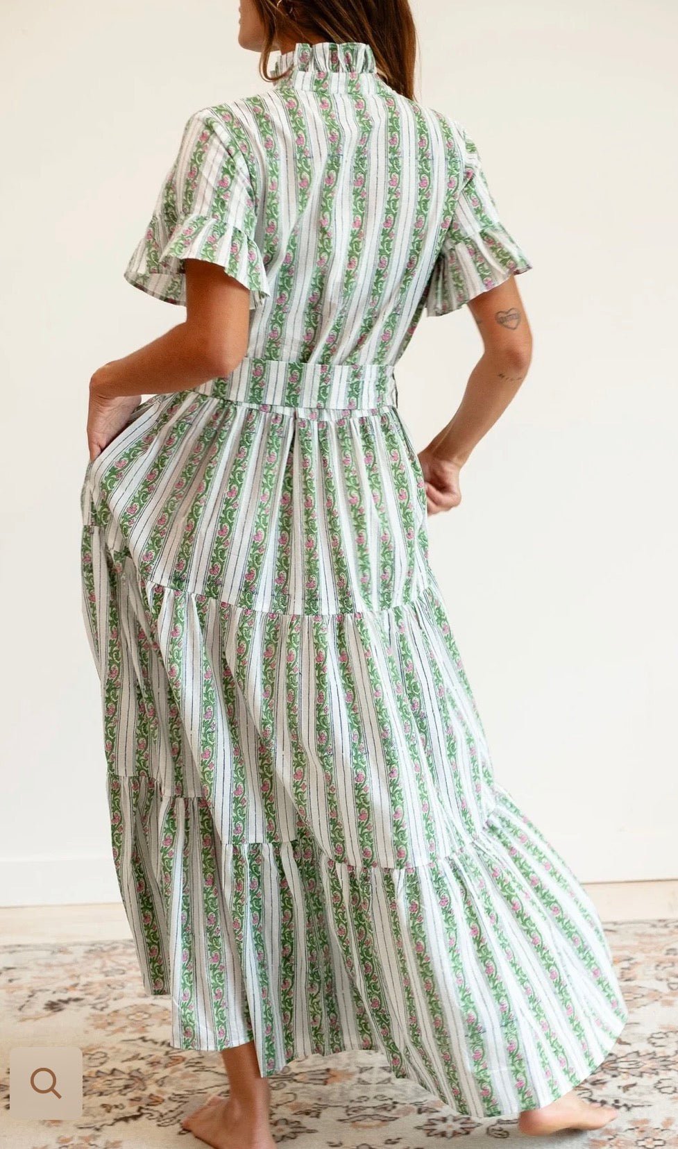 Close-up of the tiered skirt and stripe on the Sweet Pea Stripe Maxi Dress – Lady & Tucker