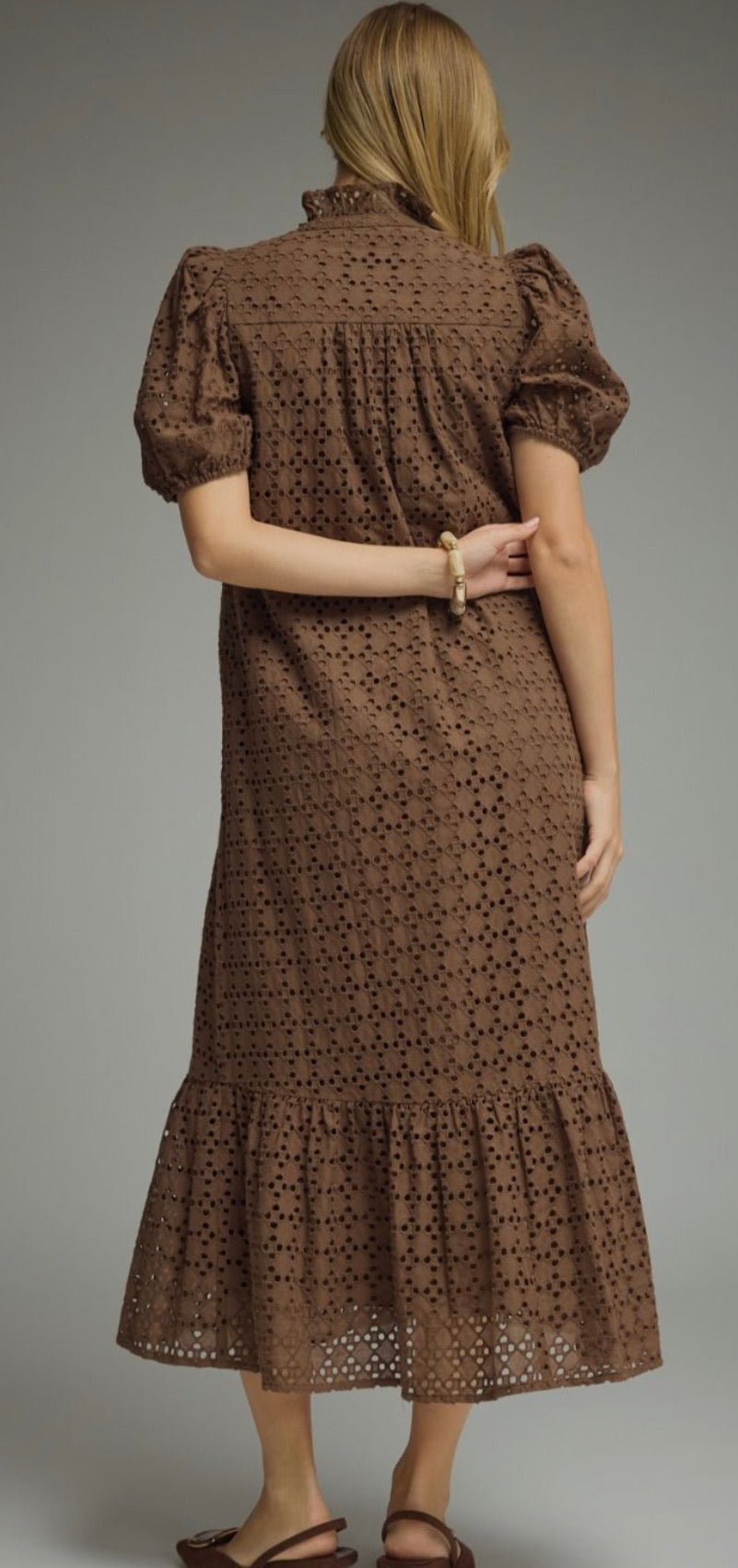 Back view of the Eyelet Mocha Maxi Dress, a mocha eyelet puff sleeve midi