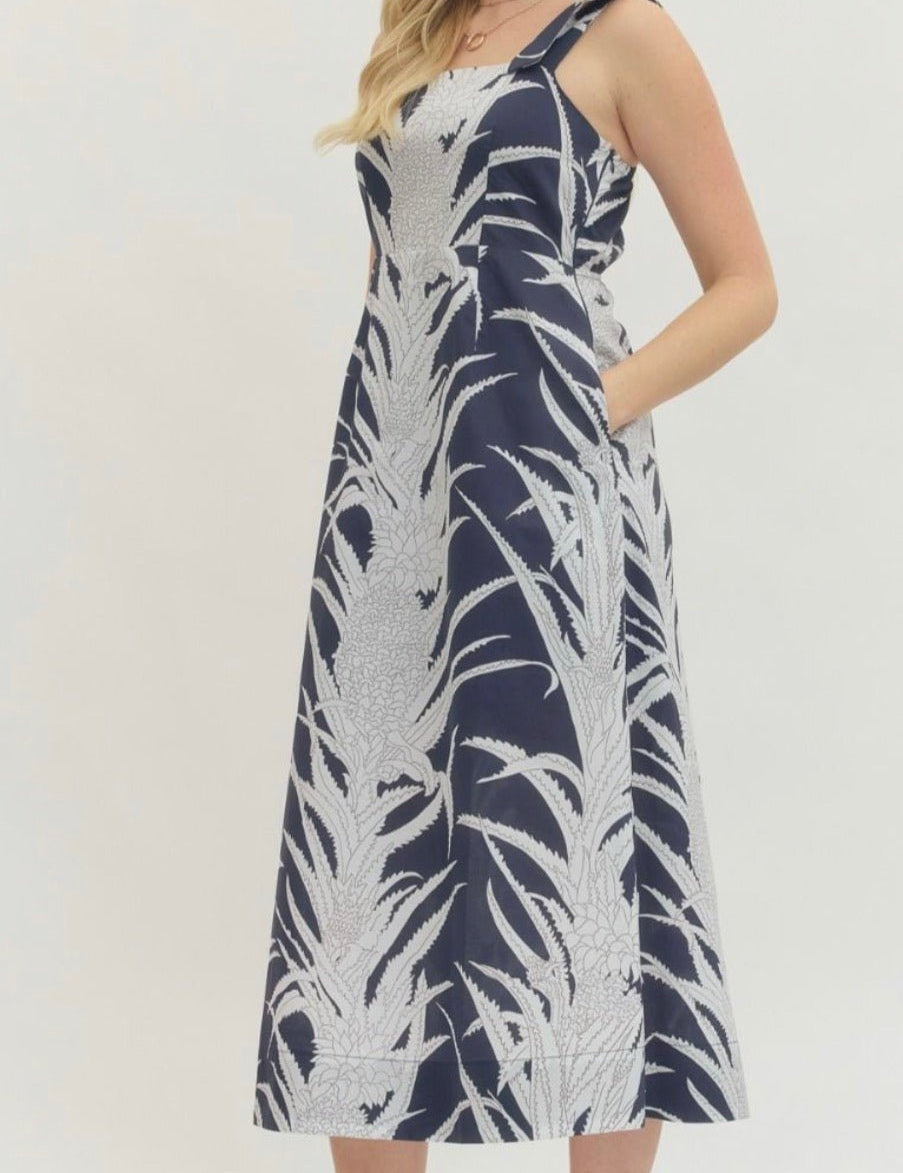 Back view of the Navy Paradise Maxi Dress, a navy A-line resort maxi