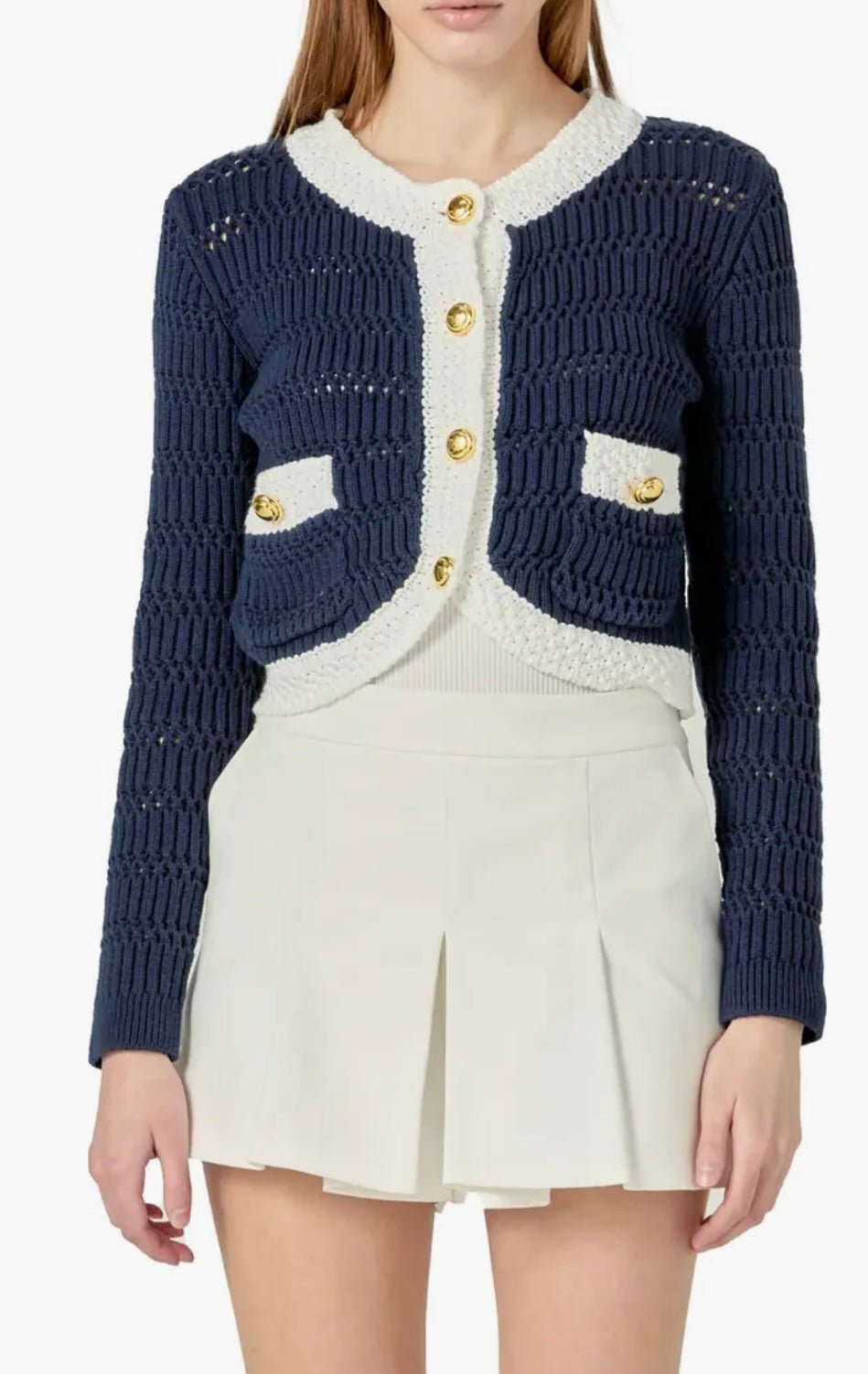 Navy Cropped Knit Sweater, a cropped navy cardigan with gold buttons, worn front view