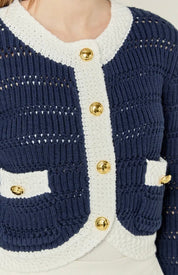 Close-up of the gold buttons and patterned stitching on the Navy Cropped Knit Sweater – Lady & Tucker