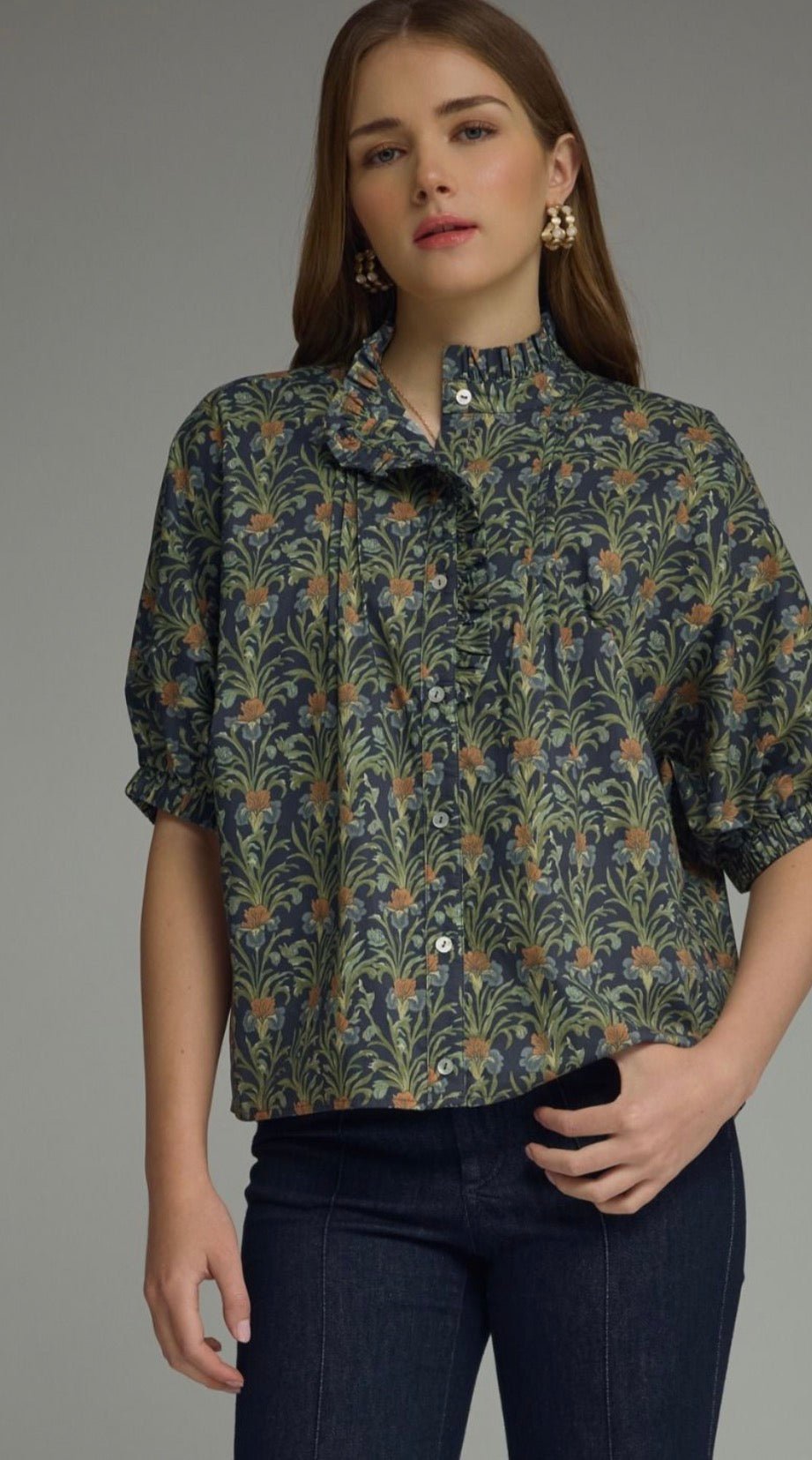 Navy In Blooms Top, a navy floral ruffle-neck puff sleeve top, worn front view